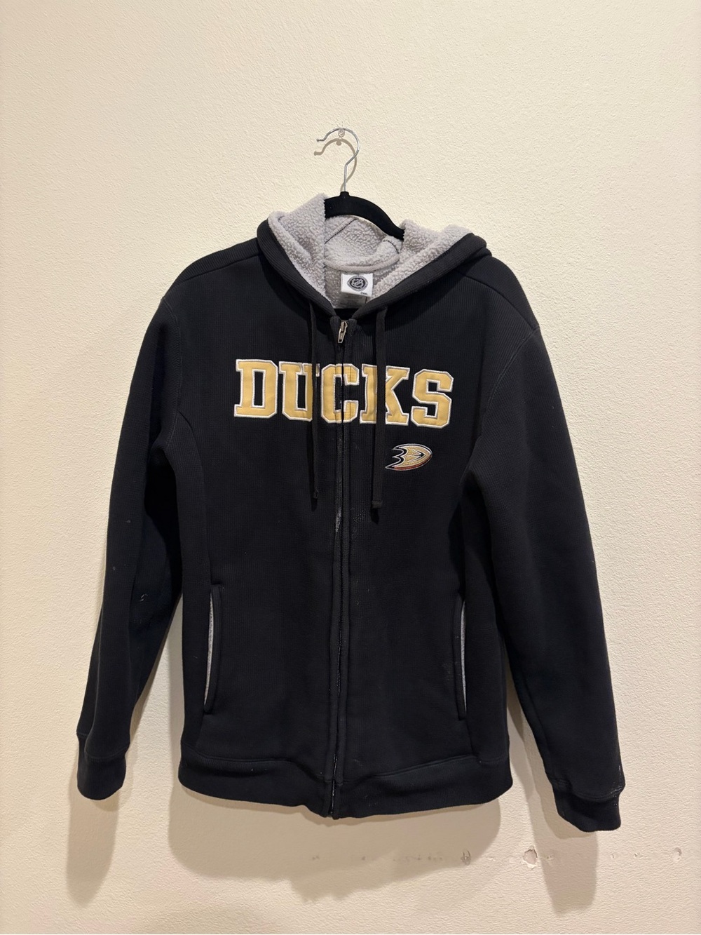 NHL Black Hoodie with Cream Sherpa Lining and Gold Accent